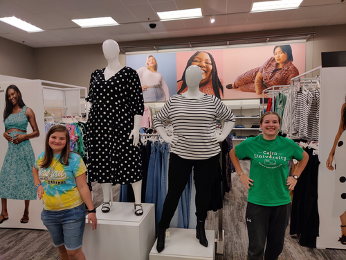 Buying maternity shirts for Heather, and the girls thought the mannequins' positions were pretty funny.